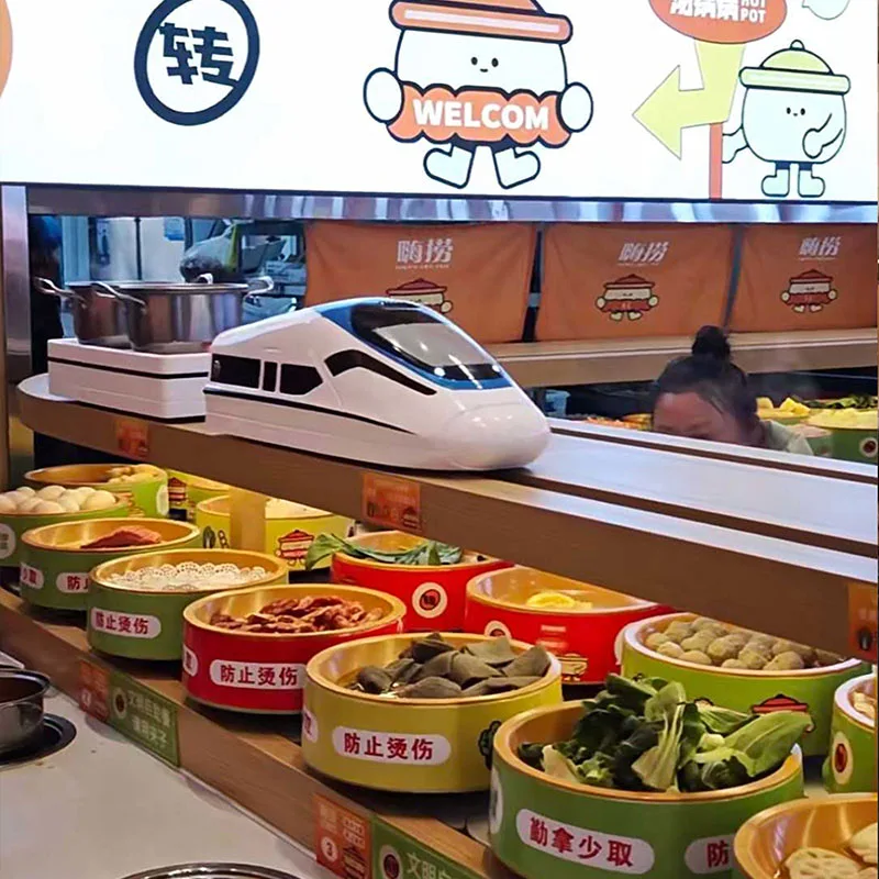 Sistema automático de entrega de alimentos en olla caliente